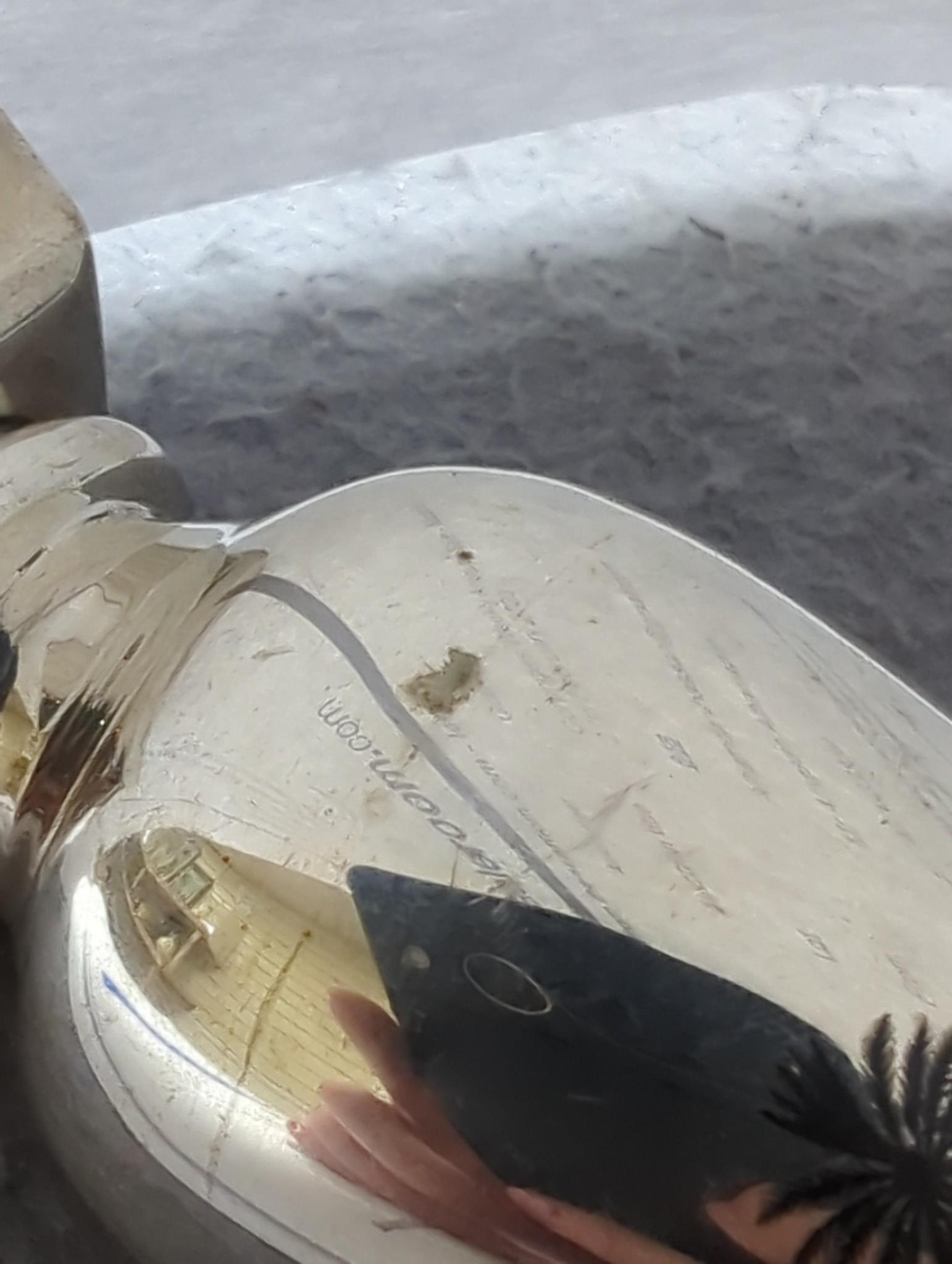 Thirteen assorted Iraq white metal and niello condiments, circular box, five similar napkin rings, a brooch and a pair of similar (damaged) candlesticks.